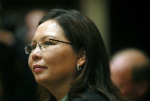 Maj. Tammy Duckworth, who was recently nominated by President Barack Obama as the assistant secretary of public and intergovernmental affairs for the Department of Veterans Affairs, listens as Gen. Craig McKinley, chief, National Guard Bureau, introduces her as the keynote speaker during the National Guard Bureau's "Women Taking the Lead" event held in recognition of Women's History Month in Arlington, Va., Tuesday, March 17, 2009. Duckworth, a helicopter pilot with the Illinois Army National Guard, lost both legs while deployed to Iraq in 2004 when the helicopter she was piloting came under rocket-propelled grenade and small arms fire. She spoke of her experiences in Iraq and those she served with.