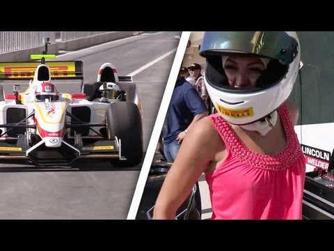 Playmate rides in F1 car with Mario Andretti