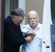 Ian Turnbull, left, is escorted out of court during the trial.