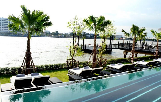 Sunlounges beside the infinity pool.