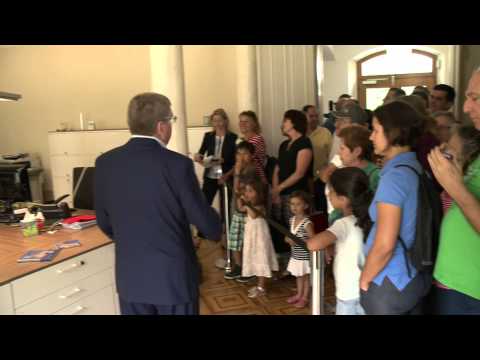 IOC President Thomas Bach shows Lausanne citizens around the IOC