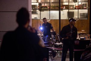 Israeli police officers examine the scene of a shooting attack in Tel Aviv, Israel, Wednesday, June 8, 2016.