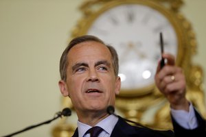 The governor of the Bank of England Mark Carney takes a question, during a press conference, his first since the leave result of the European Union referendum, at the Bank of England in the City of London, Thursday, June 30, 2016.