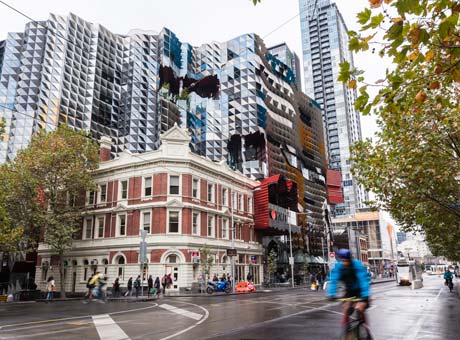 City street scene with RMIT building and cyclists