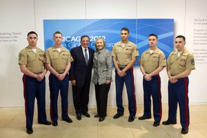 Secretary of Defense Leon E. Panetta and Secretary of State Hilary Clinton pose for a photo with Marines while at the NATO