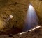 Ambient light streams through two fissures more than 100 metres above the cave floor into the Majlis Al Jinn, one of the ...