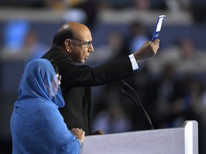 Khizr Khan, father of fallen US Army Capt. Humayun S. M. Khan, holds up his copy the United State Constitution as he speaks during the final day of the Democratic National Convention in Philadelphia , Thursday, July 28, 2016.