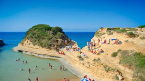 Visit a quiet, secluded beach with 1000 of your close friends in Corfu.