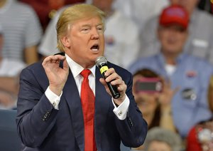 In this Dec. 12, 2015, photo, Republican presidential candidate Donald Trump speaks at a town hall meeting in the Convocation Center on the University of South Carolina Aiken campus in Aiken, S.C.