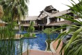 Rooms overlooking the lagoon-like pool at Villa Samadhi, Kuala Lumpur, Malaysia.

