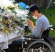 A man prays at a makeshift altar in front of the Tsukui Yamayuri En care centre for the disabled in Sagamihara, Japan. 