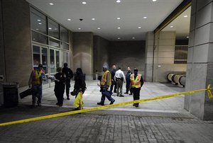  Metro workers are seen at the Mount Vernon Square station, near where a Metro subway train derailed earlier in the day on Sunday, Jan. 7, 2007, in Washington. A subway train derailed Sunday near downtown Washington, sending 16 people to the hospital and 