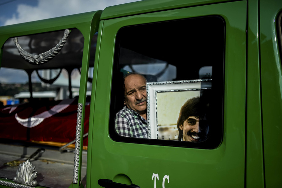 The uncle of Turkish teacher Huseyin Tunc killed in the suicide attack cries as he sits in the truck carrying the coffin on June 30 2016. The death toll has risen to 43.(Bulent Kilic, AFP)