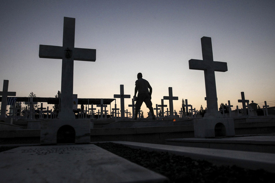 A man walks past the graves of soldiers killed in the 1974 Turkish invasion of Cyprus at the Tymvos Macedonitissas military cemetery in Nicosia, Cyprus on July 19 2016. (Yiannis Kourtoglou, Reuters) 
