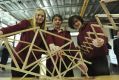 Namadgi School year 8 students Brianna Cather, Kiran Watkins-Molan and Shaun Payne with the remains of their 560-gram ...