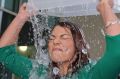 Greens Senator Sarah Hanson-Young completes the ice bucket challenge outside Parliament House in Canberra in August 2014.