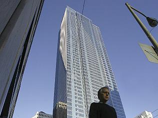 Pedestrians walk past the Millennium Tower condominium in Sa