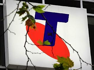 A Telstra logo is seen through a tree branch with only a few leaves on it in Sydney, Australia, Thursday, Aug. 11, 2011. Telstra Corp., Australia's largest telecommunications company, reported a 17 percent fall in annual profit to 3.2 billion Australian dollars (US$3.3 billion). (AP Photo/Rick Rycroft)