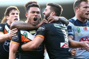 SYDNEY, AUSTRALIA - AUGUST 07:  David Nofoaluma of the Tigers celebrates scoring a try during the round 22 NRL match ...