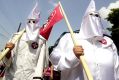 Members of the Ku Klux Klan are on the march.