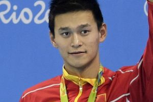 China's silver medal winner Sun Yang waves during the ceremony for the men's 400-meter freestyle final at the swimming ...