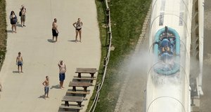 FILE - In this July 9, 2014 file photo, riders are propelled by jets of water as they go over a hump while riding a water slide called "Verruckt" at Schlitterbahn Waterpark in Kansas City, Kan. A 12-year-old boy died Sunday, Aug. 7, 2016,