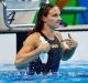 Hungary's Katinka Hosszu appears to be reminding commentators who did the swimming after winning gold with a new world ...