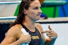 Hungary's Katinka Hosszu appears to be reminding commentators who did the swimming after winning gold with a new world ...