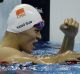 Sun Yang pumps his fist after winning the 200 metre freestyle