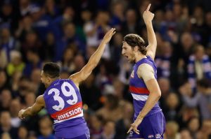 Unleashed: Bulldogs Jason Johannisen and Marcus Bontempelli celebrate after beating the Roos.