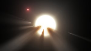 File - This illustration shows a star behind a shattered comet. Observations of the star KIC 8462852 by NASA's Kepler and Spitzer space telescopes suggest that its unusual light signals are likely from dusty comet fragments, which blocked the light of the star as they passed in front of it in 2011 and 2013.