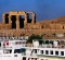 Age of contrasts ...  a cruise ship passes the ruins of Kom Ombo.