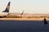 Airport workers filmed a passenger defying all odds to make his flight.