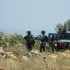 Israeli Border Police prepare to attack Palestinian teenagers and young men.