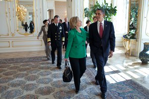 File - President Barack Obama talks with Secretary of State Hillary Rodham Clinton following the expanded delegation bilateral meeting with President Dmitry Medvedev of Russia at Prague Castle in Prague, Czech Republic, April 8, 2010.