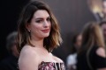 Anne Hathaway attends the premiere of Disney's 'Alice Through the Looking Glass' at the El Capitan Theatre in May, two ...