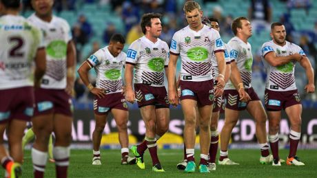 Sore one: Manly players show their dejection after Tom Trbojevic's mistake allowed Canterbury's Josh Reynolds to score ...