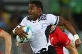 Gold medal winners: Vatemo Ravouvou  breaks through for Fiji to score in the sevens. Getty Images