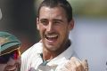 Australia's Mitchell Starc celebrates with teammates after taking the wicket of Sri Lanka's Dimuth Karunaratne.