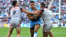 Back in the NRL: Jarryd Hayne takes on the defence in his first run for the Titans during the match against the Warriors. 