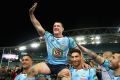 Paul Gallen of the Blues is chaired off the field after playing his final Origin game.