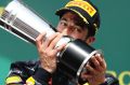 Daniel Ricciardo of Australia and Red Bull Racing with his second-place trophy at the German Grand Prix in Hockenheim.