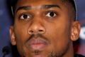 British boxer Anthony Joshua  looks on during a media conference at the Dorchester Hotel in London.