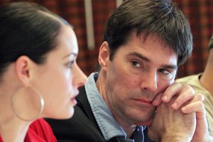 Thomas Gibson, right, listens as Paget Brewster, left, answers questions about the CBS television drama "Criminal Minds," in which they both star, during an informal news conference at the 2007 CBS Winter Press Tour, Thursday, Jan. 18, 2007, in Pasadena, Calif.