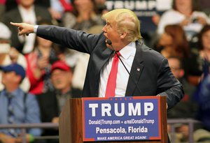 Republican presidential candidate Donald Trump points to the audience as he speaks during a campaign rally at the Pensacola Bay Center in Pensacola, Fla., Wednesday, Jan. 13, 2016.