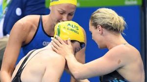 Support: Cate Campbell is comforted by Sweden's Sarah Sjostrom and Denmark's Jeanette Ottesen after her shock 100m loss.