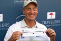 Jim Furyk of the United States poses with his scorecard after shooting a record 58 during the final round of the ...