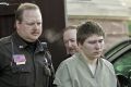 Conviction overturned: Brendan Dassey is escorted out of court in 2006.