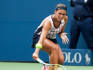 Monica Puig (PUR) in action against Venus Williams (USA) during Round 1 of the 2015 US Open at the USTA Billy Jean King National Tennis Center in Flushing Meadows, New York August  31, 2015