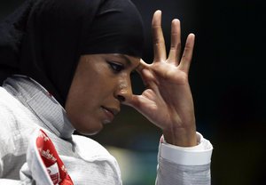 Ibtihaj Muhammad of the United States reacts after losing against Cecilia Berder of France in the women's individual saber fencing event at the 2016